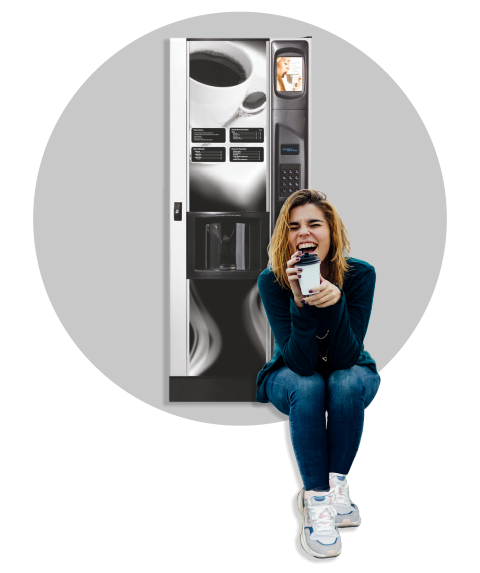 Girl enjoying coffee from a vending machine