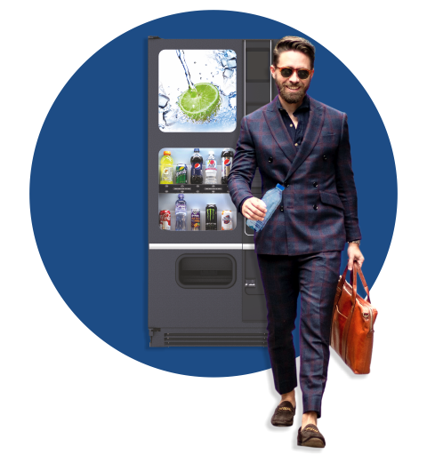 Man with bottle of water from beverages vending machine